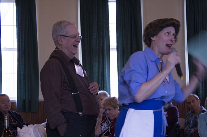 Julia Child, played by actor Mary Ann Jung, pulls Jim Mills out of the crowd to play the role of Child’s husband, Paul Cushing Child.