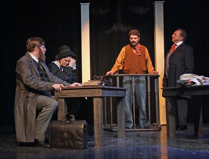 Actors rehearse for "The Judicial Murder of Mrs. Surratt" at Aldersgate Church Community Theater. From left are Mytheos Holt (Frederick Aiken), Charlene Sloan (Mary Surratt), Michael Schwartz (John Lloyd) and Jim Pearson (John Bingham).