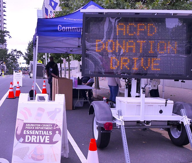 Sign flashes to attract passersby to the ACPD Essentials Drive on Courthouse Road on Oct. 4.