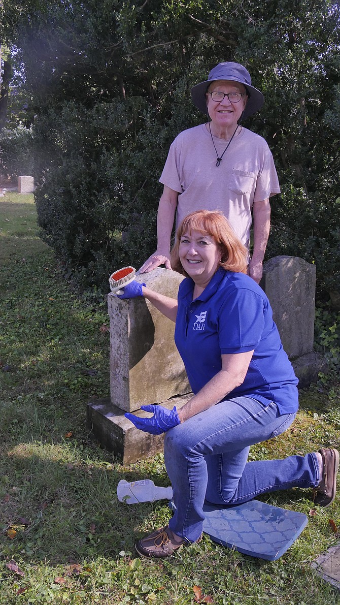 Jackie Quigley, leader of the Arlington House chapter of the Daughters of the American Revolution and Larry Danforth, Supervisor of Walker Chapel Cemetery