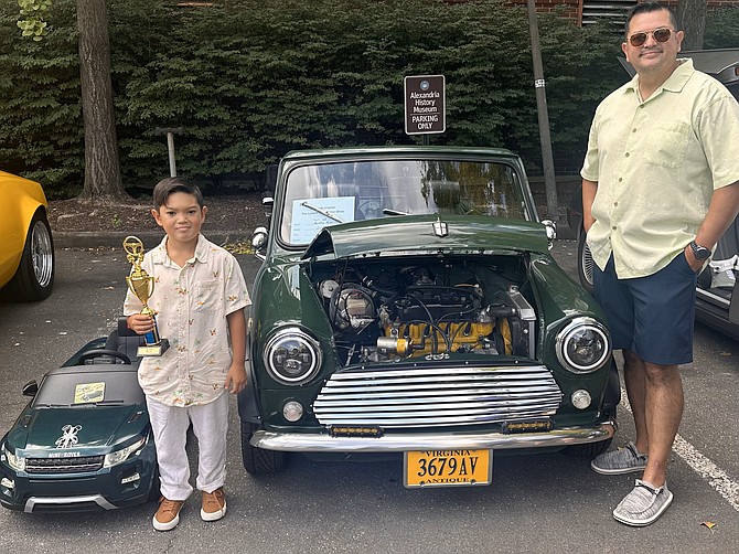 Amias Paz and his father Walter Paz at the Classic Car Show Sept. 16 at the Lyceum. The duo won Best in Show for the restored Austin Roper and the mini replica vehicle.