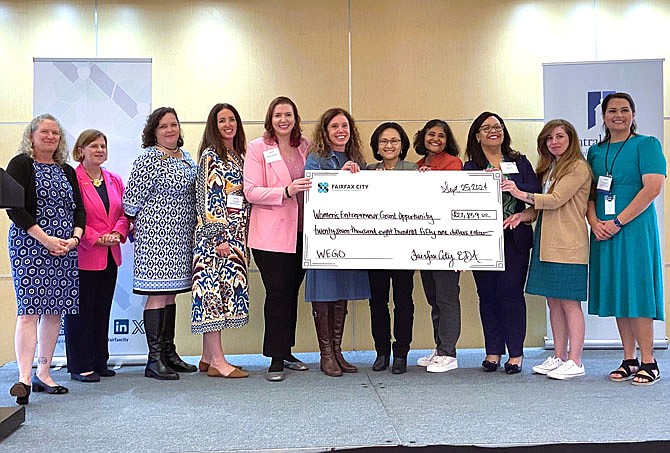 From left are EDA Commissioner Beth Young; Mayor Catherine Read; CFCC Executive Director Jennifer Rose; FCED Tourism Manager Michelle Smith; business owners/grant recipients Stephanie Dallojacono, Smiley Skin Beauty; Julia Hughes, BE2 Pilates; Mi-Kyong Kwon, HopeSpring Child & Family Clinic; Monisha Mittal, Mittal Accelerated Communications; Eurona E. Tilley, Epiphany Pilates; and Alison Friedman, Liberty Baking Co.; and FCED Programs Manager Tara Borwey.