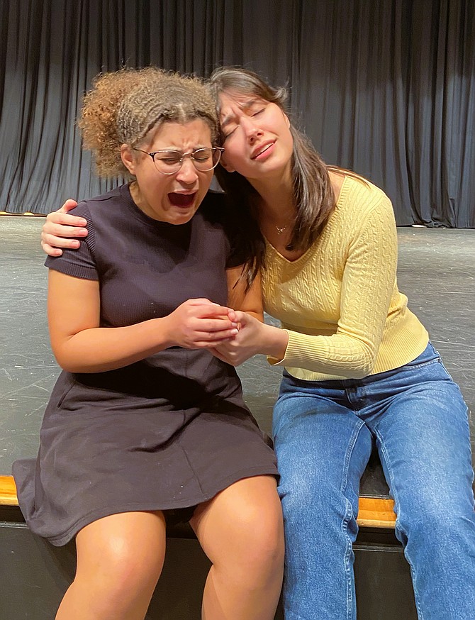 From left, Zoe Suruma, as Lady Gloucester, is comforted by her friend, Queen Lear (Charlotte Willmore).