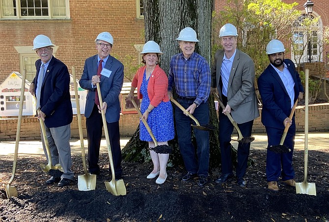 Digging in are (from left) Gerry Connolly, Henry Brinton, Catherine Read, former Fairfax Mayor David Meyer, Del. David Bulova (D-11) and Sen. Saddam Salim (D-37).