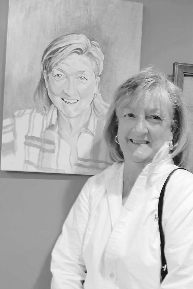 Therese Marie Stripling with a portrait of herself which was a surprise her husband had commissioned from a photograph.