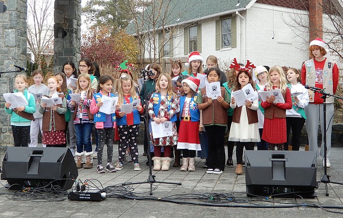 Girl Scouts of Service Unit 55/6 sings Christmas tunes at last year’s Festival of Lights and Carols.