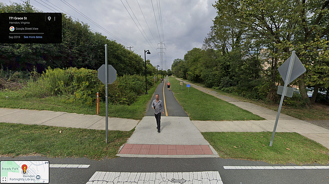 View of the tree-lined W&OD Trail as it crosses Grace Street and heads west toward Ferndale Avenue in the Town of Herndon. According to police, a woman was abducted and raped on Monday evening, Nov. 18, between Grace Street and Ferndale Avenue.