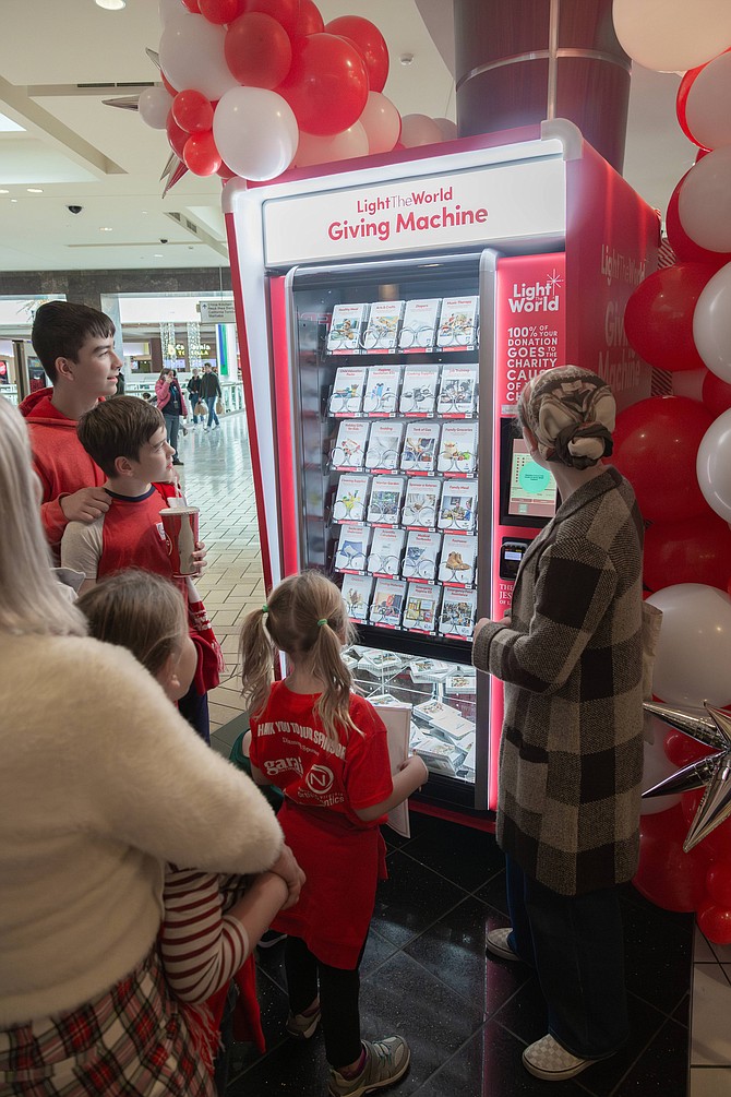 The Giving Machine looks similar to a candy vending machine.