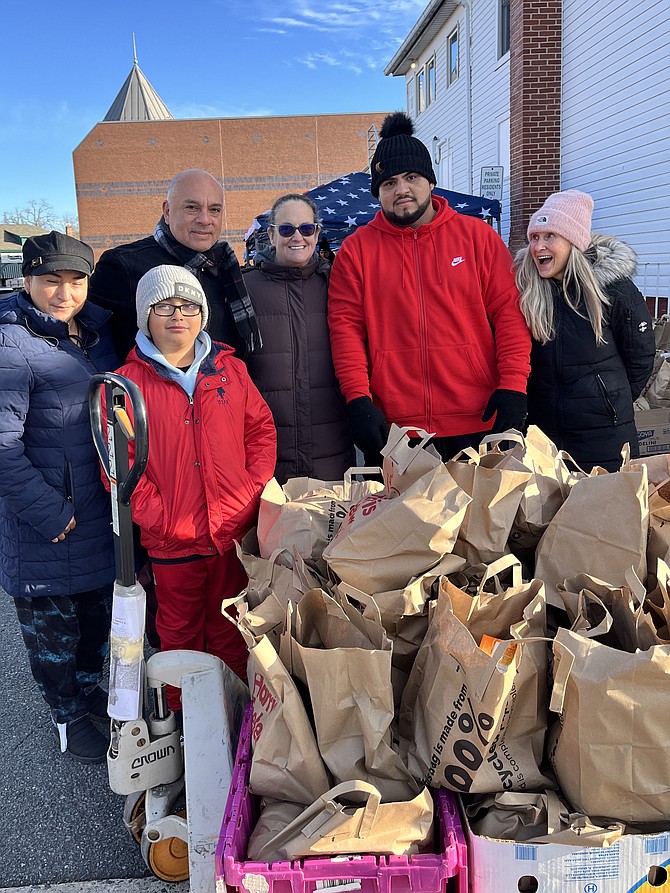 Volunteers are bundled up and ready for the Second Annual Stars & Stripes NOVA Committee Food and Clothing Donation.