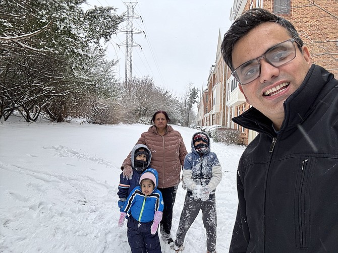 Town of Herndon-The Dhakal family: Aavya, 3, Aaryav, 6, Grandmother Manju, Aayan, 8, and Dad Pradip “They do enjoy playing with the snow. It is so much fun for them and us to play with them,” says Pradip.