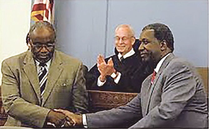 Judge Donald Haddock, center, presides over a ceremony with then-Mayor Bill Euille honoring Judge Nolan Dawkins.