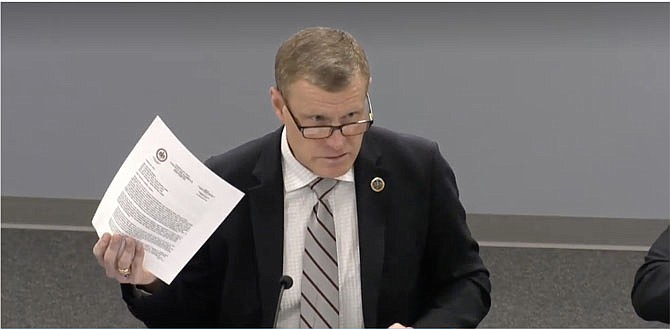 Jeff McKay, chairman of the Fairfax County Board of Supervisors, holds up his 2023 letter concerning a bill for a casino in Fairfax County at Friday’s Legislative Committee meeting. "Nothing really has changed, and I think it would make sense for us to recirculate the letter."