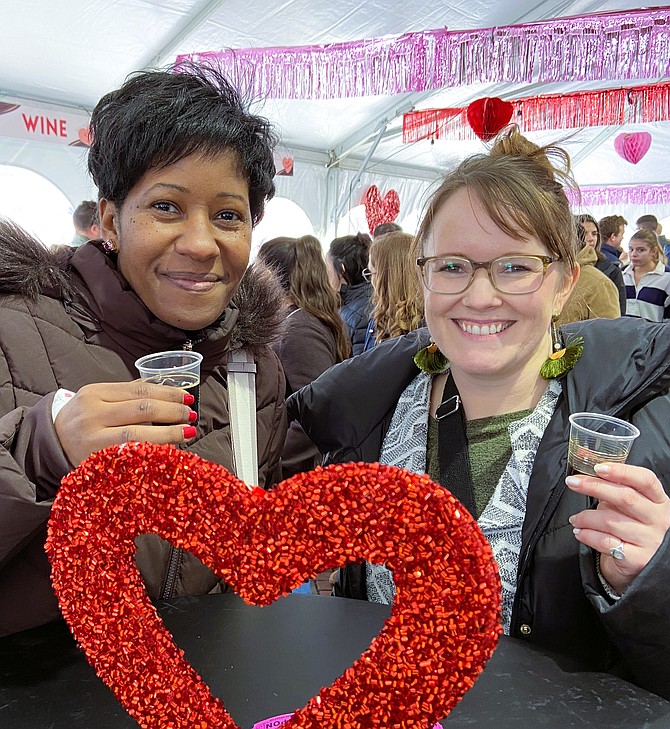 From left, Daneesha Davis and Jessica Tavenner enjoy some Teddy Bear Stout Beer.