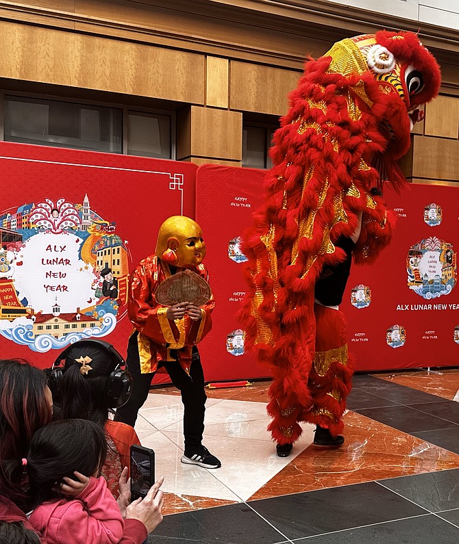 Ông Địa, or "the Earth God," performs as part of the Lunar New Year Festival Jan. 25 at The Atrium in Old Town.