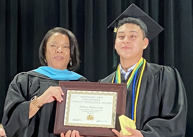 Erin Whatley with Milton Mateo and his Faculty Excellence Award.