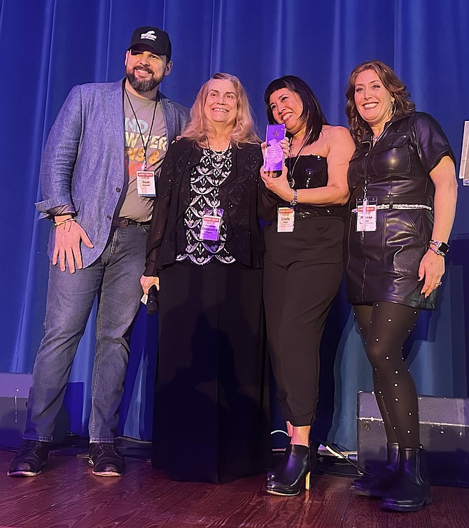 Judge Connie Frogale, second from left, was an honoree at the Center for Alexandria’s Children Banding Together concert to end child abuse Feb. 1 at the Durant Center. Pictured are: Sean Sherlock, Frogale, CAC executive director Giselle Pelaez and board chair Melissa Riddy.