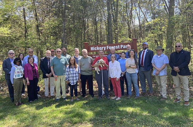 Group photo of the participants in the sign-dedication ceremony.