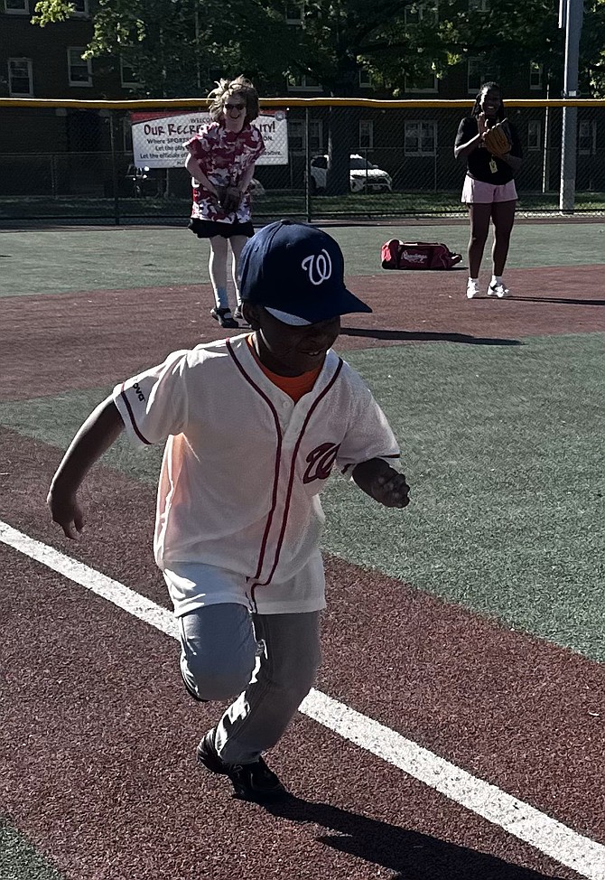 A Miracle League players heads to home after a great hit on opening day for the Miracle League of Alexandria. Photo by Janet Barnett/Gazette Packet
