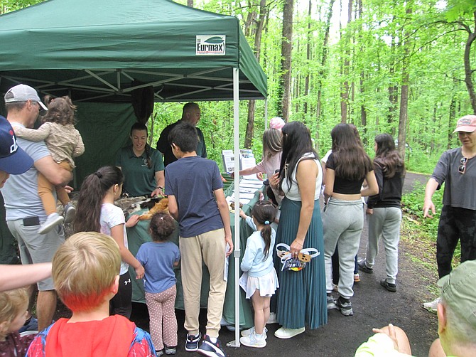 The Police Department's wildlife tent was popular, especially the animal pelts.