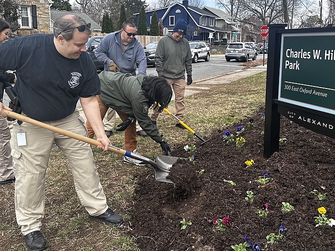 Volunteers participate in the clean up of Charles W. Hill Park March 22, the 36th anniversary of Officer Corporal Hill’s death in the line of duty.
