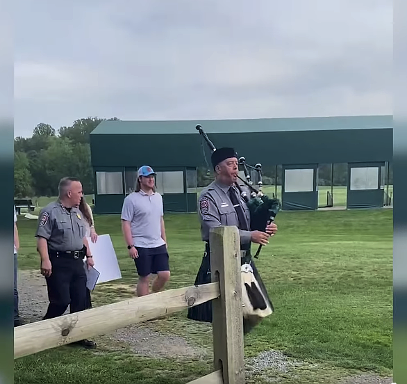 Fairfax County Police Chief Kevin Davis, a bagpiper, and others are about to surprise Fairfax athlete Michael Long on the golf course. Davis said. “This is a big announcement for you, and you worked so hard to make this happen.”