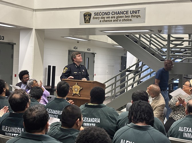 Sheriff Sean Casey smiles and attendees applaud after the sign for the newly-named Second Chance Unit is unveiled April 29 at the William G. Truesdale Adult Detention Center.