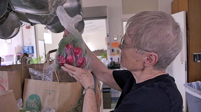 Audrey Moore, supervisor on May 12 for the Friends of Urban Agriculture (FOUA) food bagging collection
