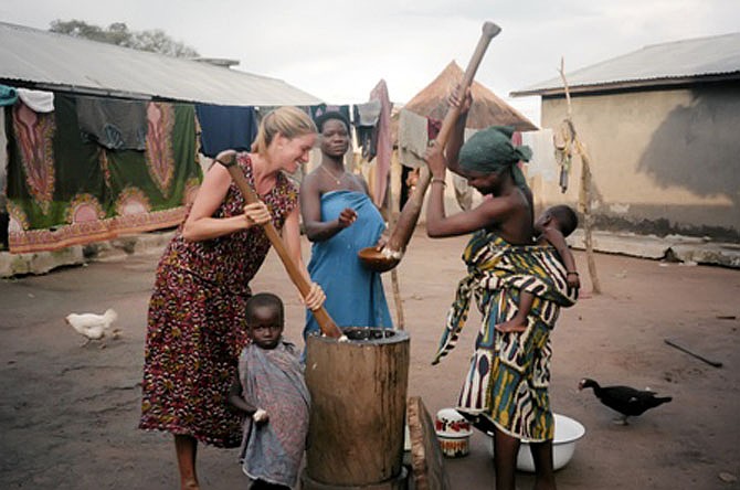 Sara Holtz, Naka, pounding fufu in Togo while serving in the Peace Corp