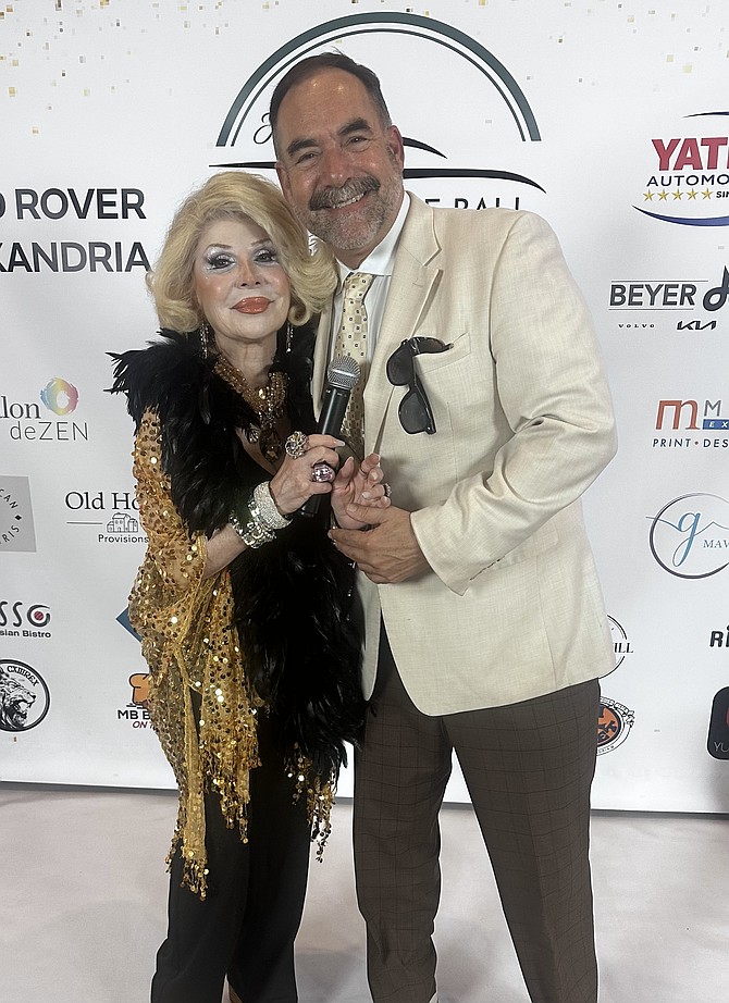 ”Joan Rivers” and Jim Warren at the High Octane Ball at Land Rover of Alexandria May 17. The charity gala raised thousands of dollars for local charities and kicked off the Festival of Speed and Style the following day.