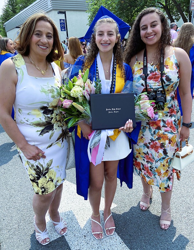 Grad Joline Wisa is flanked by (from left) mom Nevine Abdelmessih and sister Caren Wisa.