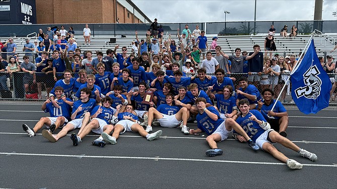 West Potomac Wolverines lacrosse team in the school stadium.
