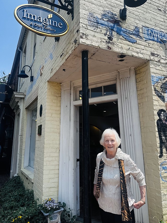 Carol Supplee stands in front of her Old Town shop Imagine Artwear, which is closing June 30 after 33 years on King Street.