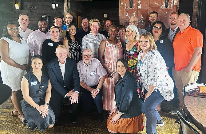 Participants of the Leadership Alexandria class of 2025 are joined by graduates of the class of 2005 and members of the Leadership Alexandria Alumni Association for a reunion at Cooper Mill restaurant June 23.