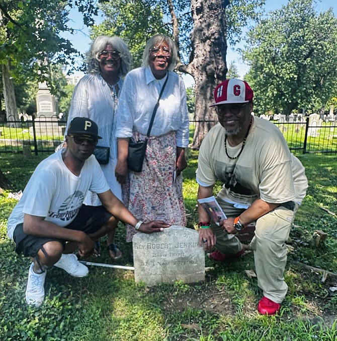 Descendents of Rev. Robert Jenkins gather at his headstone June 21 in Douglass Memorial Cemetery. Pictured are: Bernard Ford, Darnella McGuire-Nelson, Beatrice S. McGuire and Steven Nelson.