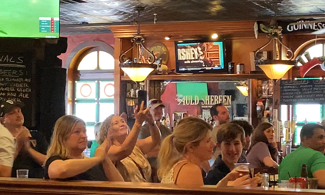 Some of the customers applauding and photographing the ceremony.
