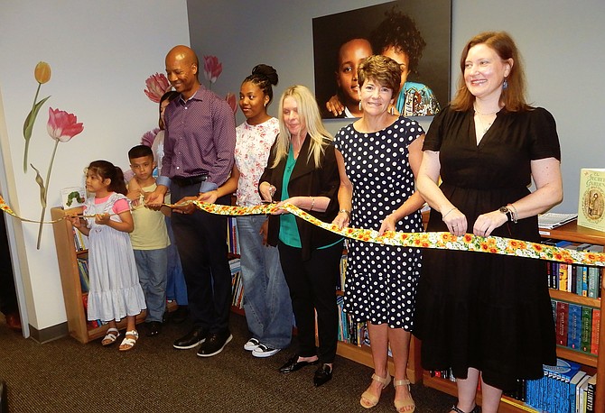 Cutting the ribbon are (from left) Addelyn and Josue Erazo, Gabe and Qiqi Derosier, Abra Kurt, Karen Wheeler and Kimberly Reinhard.
