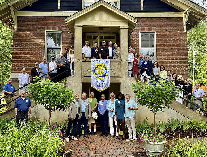 Members of the Rotary Club of Great Falls gather in front of the Great Falls Grange at the Officers’ Installation Ceremony. Photo by Scott Kelly