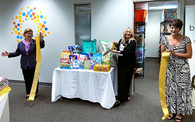 Celebrating after the ribbon cutting are (from left) Fairfax Mayor Catherine Read, Abra Kurt and Britepaths Board of Directors President Karen Wheeler.