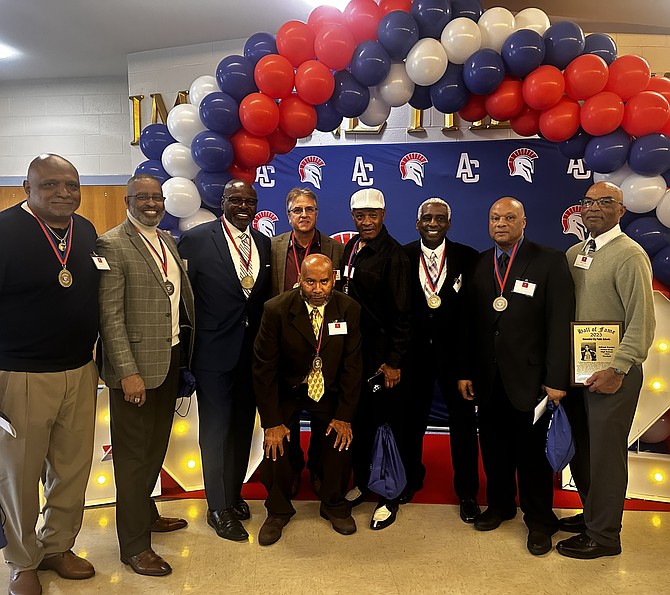 Newly honored members of the ACPS Athletic Hall of Fame pose for a photo at the induction ceremony Oct. 11 at Alexandria City High school.