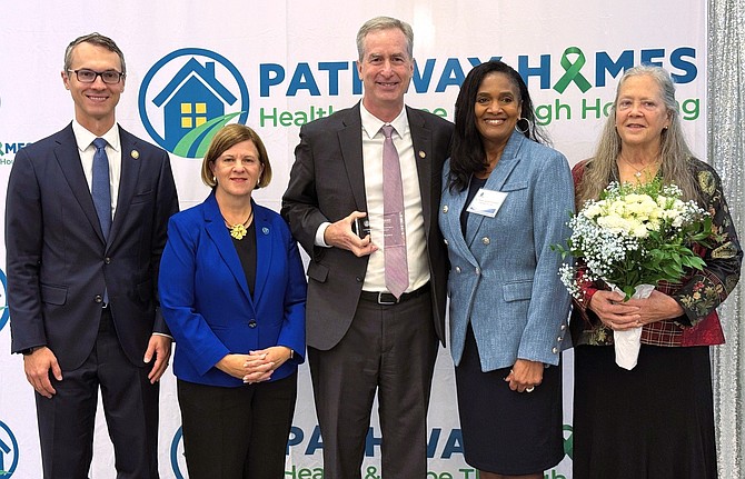 From left are James Walkinshaw, Catherine Read, David Bulova, Pathway Homes President and CEO Sylisa Lambert-Woodard, and Smitty Connolly.