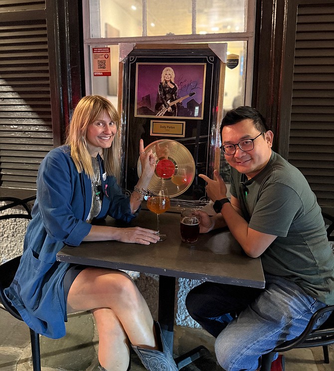 Outside High Side is Jana Klavina, owner of Mara Hair and Mode Studio, with Jinson Chan owner of High Side.