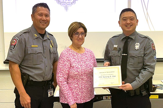 From left are Capt. Aaron Spooner, assistant station commander; CAC Chair Karen Bilak and PFC Kyoung Pak.