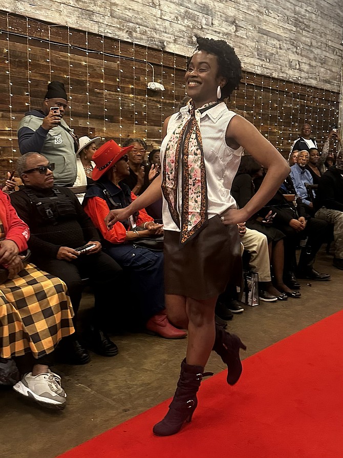 A model walks the runway during the 3rd annual IMPerfeKtlyMade Foundation fashion show Nov.1 at The Garden. The show featured all blind and visually impaired models showcasing fashions from local designers.