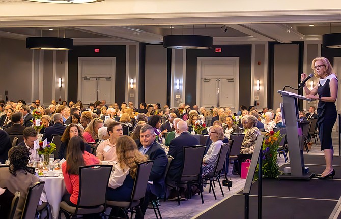 Tara Ruszkowski addresses the people attending The Lamb Center’s annual banquet.
