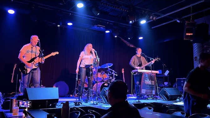 Singer Kristyn Woldow with Beau Dure and another guitarist.