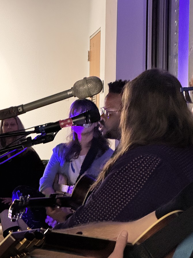 Caleb Hacker, center, sings “Dazzler” while Hall, Fridrich, and Mendelson look on.