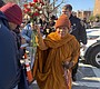 Crowds line the streets as a Buddhist monk …