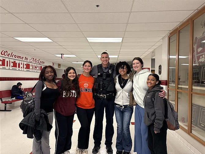 Students at McLean High School gather with their school resource officer to celebrate National School Resource Officer Appreciation Day on Feb. 15.