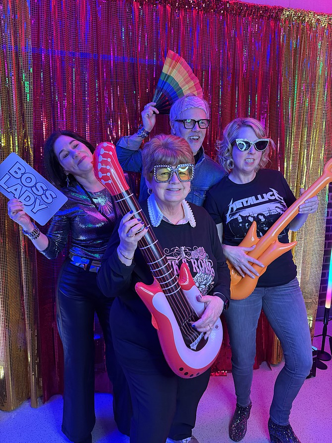 Jill Schaub, Shannon Steene, Virginia Kinneman and Jennifer Ferrara rock out at the Banding Together Gala to benefit the Center for Alexandria’s Children Feb. 21 at the Durant Center. The gala raised more than $146,000 to prevent and combat child abuse.
