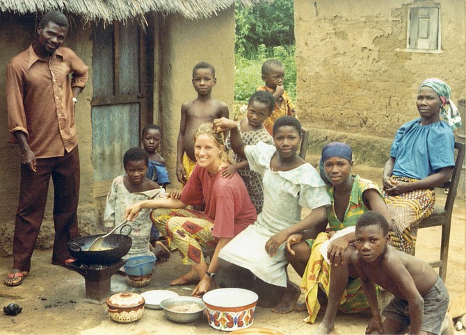 Sara Holtz, cooking and eating with her host family in Togo
